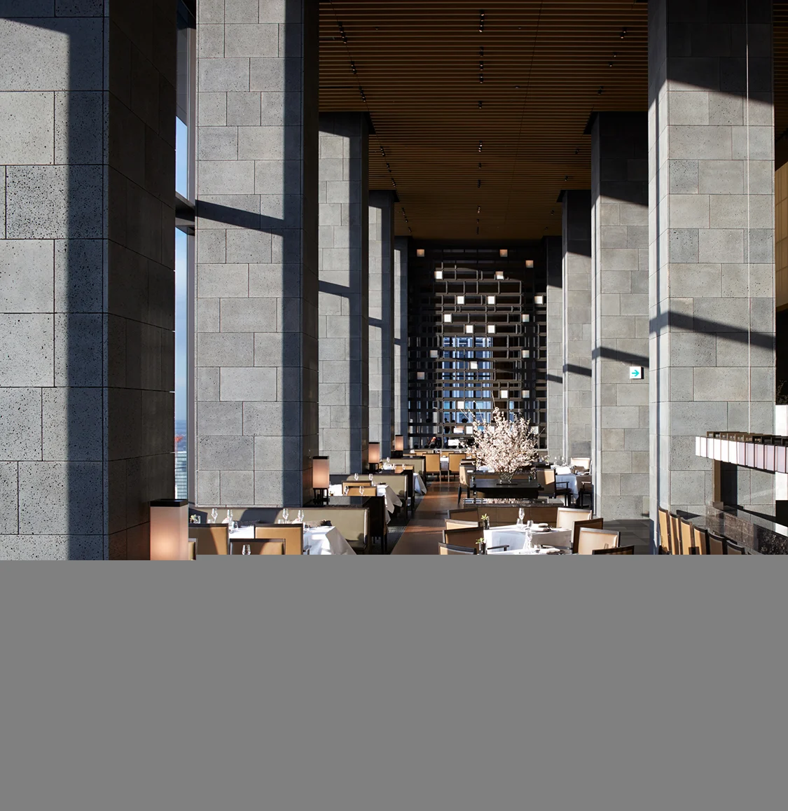 Interior space at Aman Tokyo finished in wood, stone and earth tones