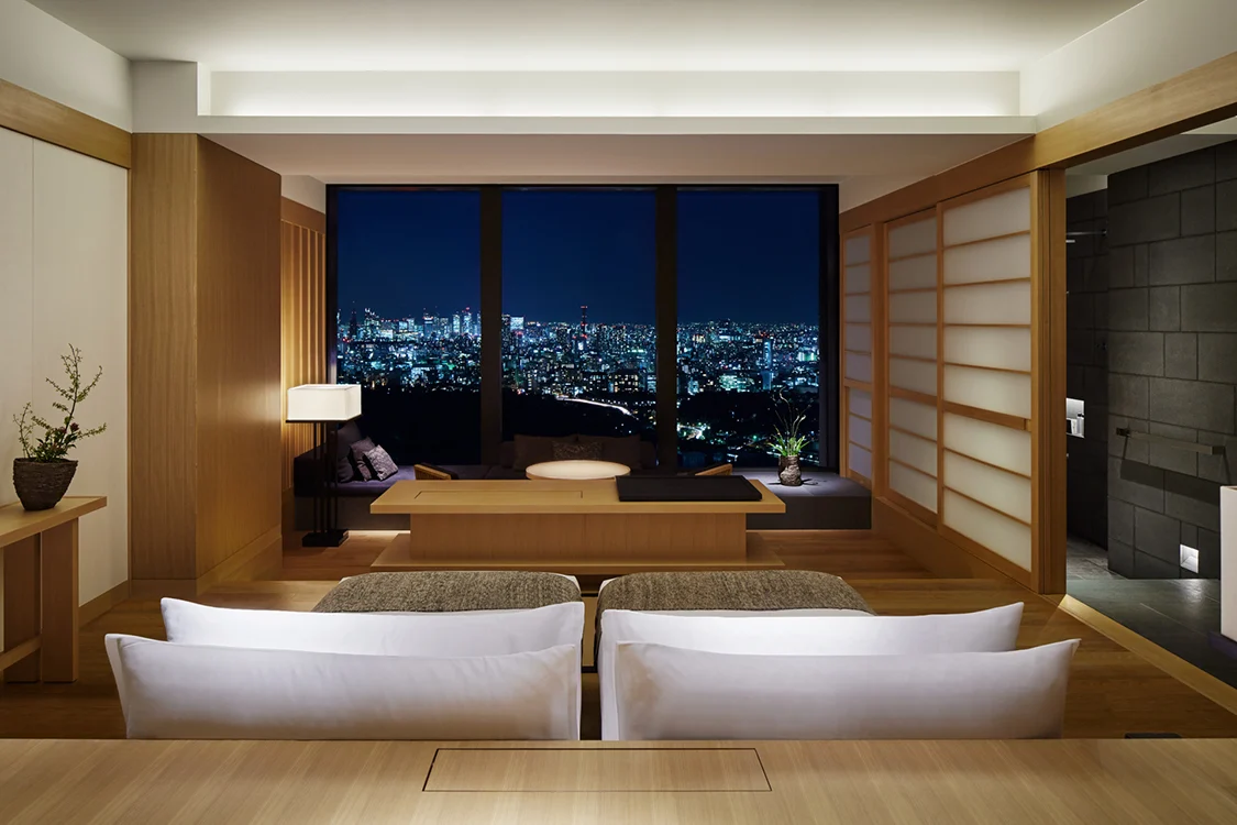 Aman Tokyo suite with floor-to-ceiling windows and minimalist Japanese decor