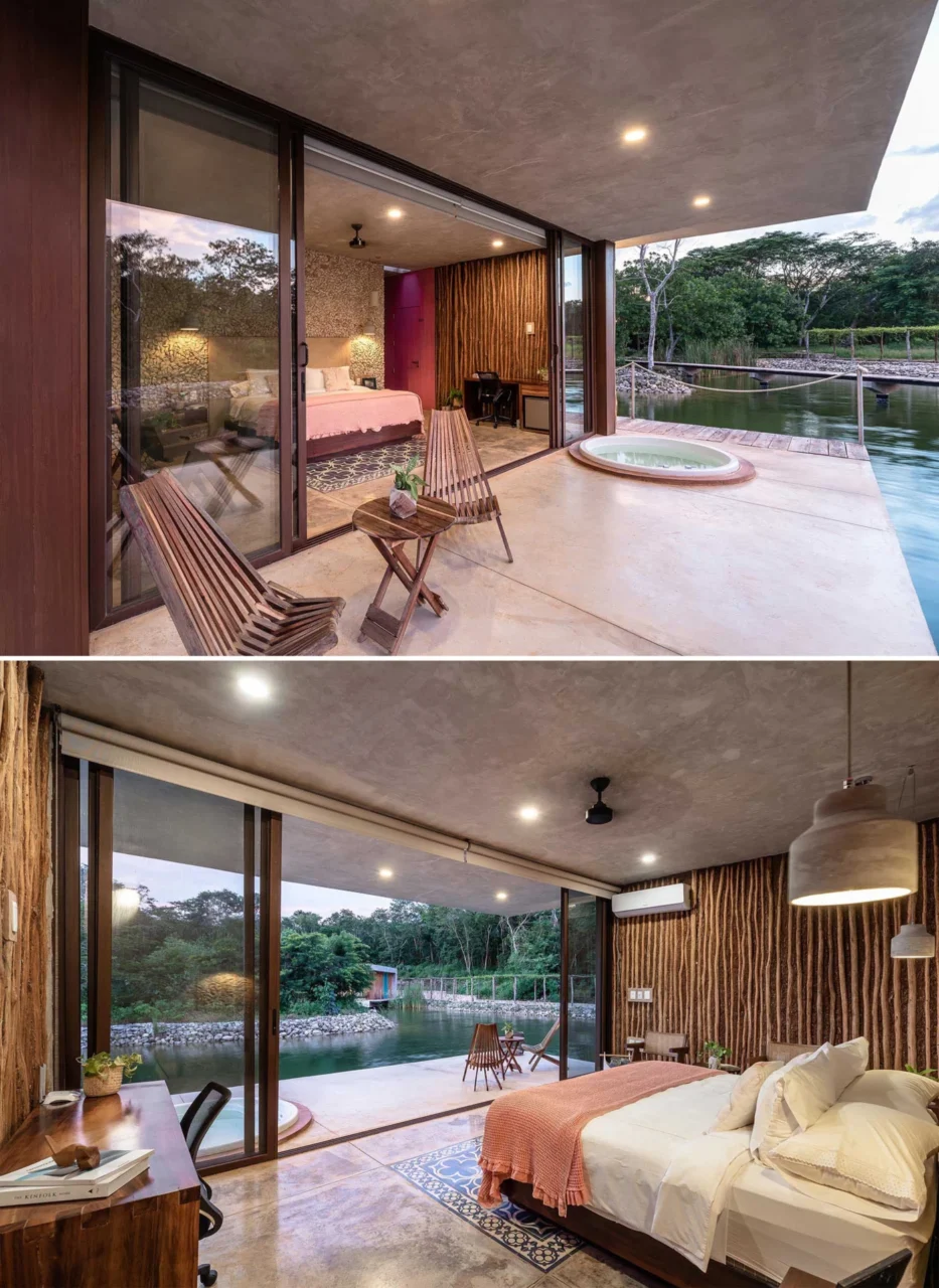 Guest room with a timber accent wall and sliding doors onto the water