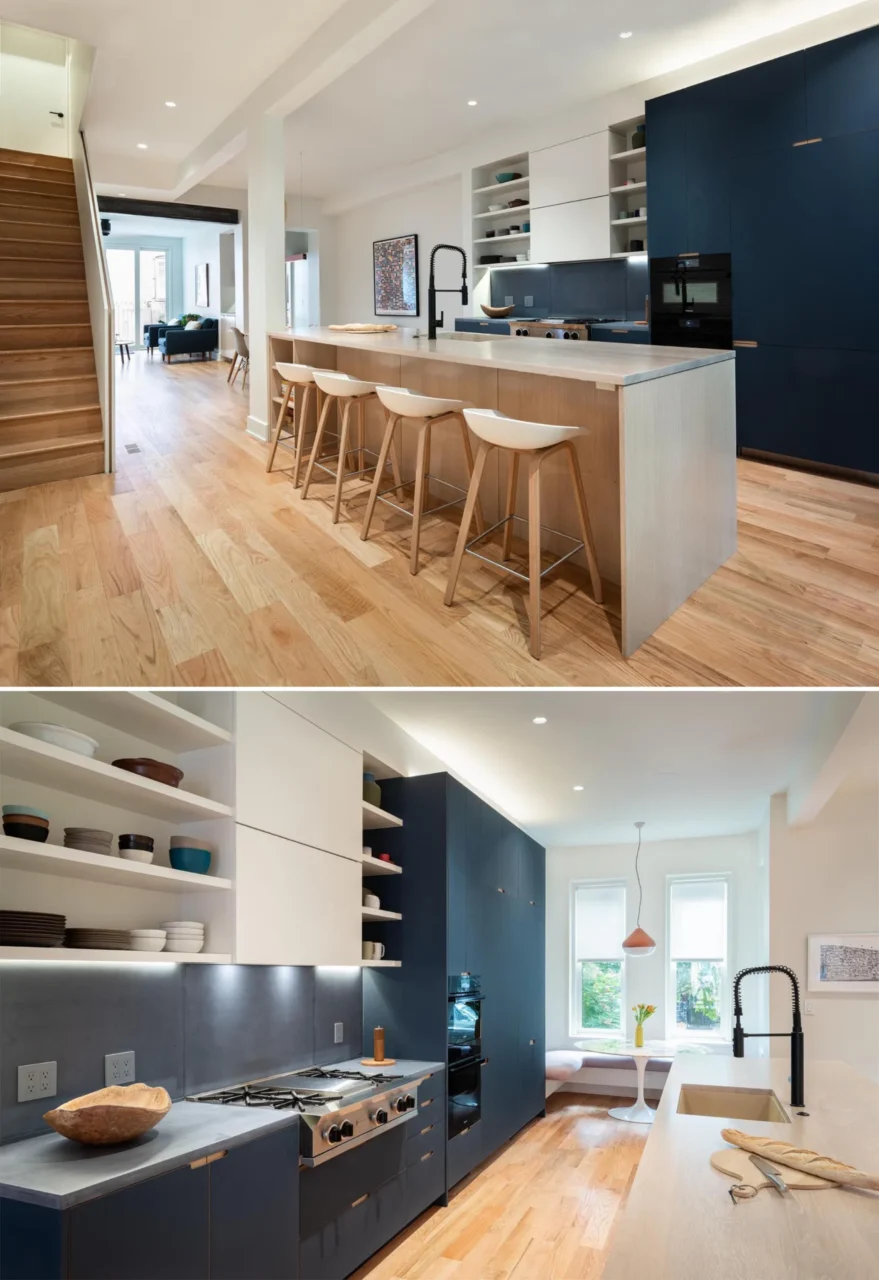 Kitchen with blue and white cabinets, grey countertops and backsplash, and a wood island with seating