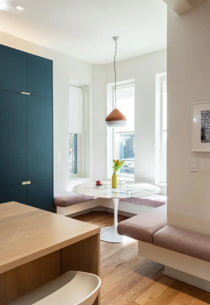 Built-in breakfast nook with upholstered benches in the bay window