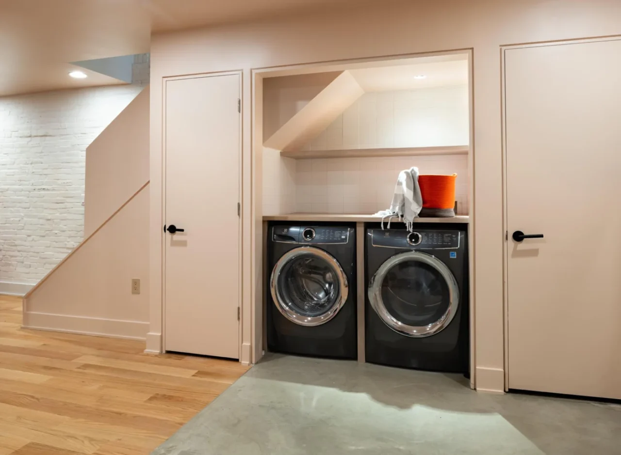 New laundry area in the basement at the bottom of the stairs