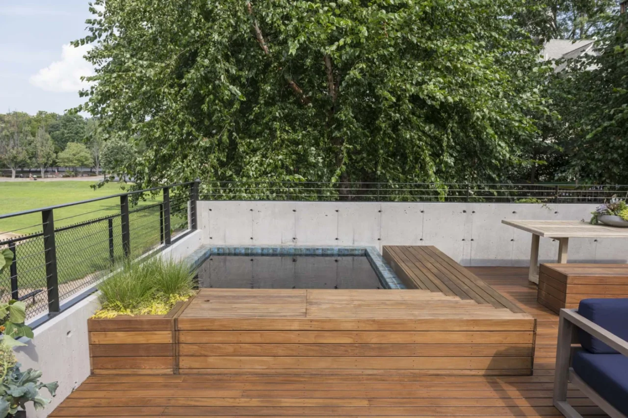 Garage pavilion with a custom hot tub set into the roof, a steam room and a sauna