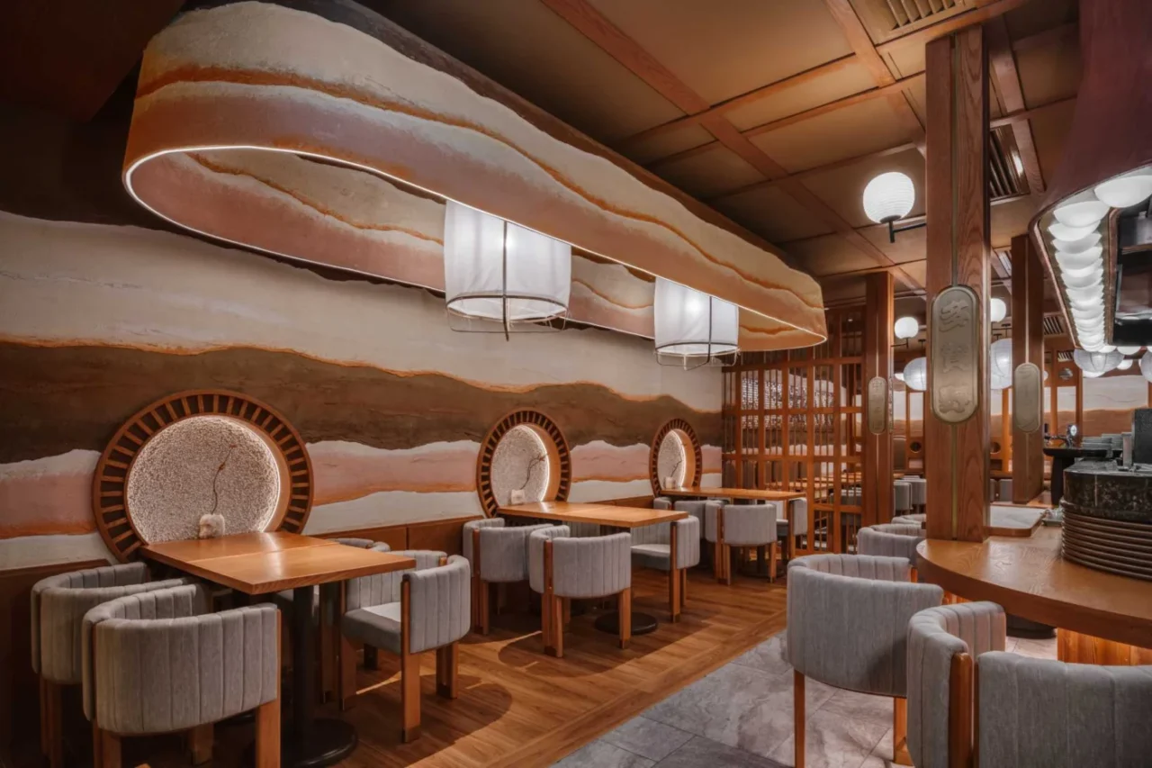 Takano Ramen restaurant in Hong Kong by Minus Workshop, with warm clay-coloured walls