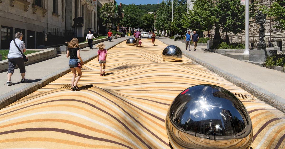 a-large-scale-public-art-mural-that-appears-to-warp-the-street