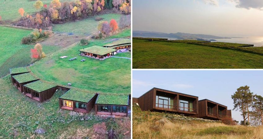 a-large-green-roof-allows-the-rooms-of-this-hotel-to-blend-into-the-landscape