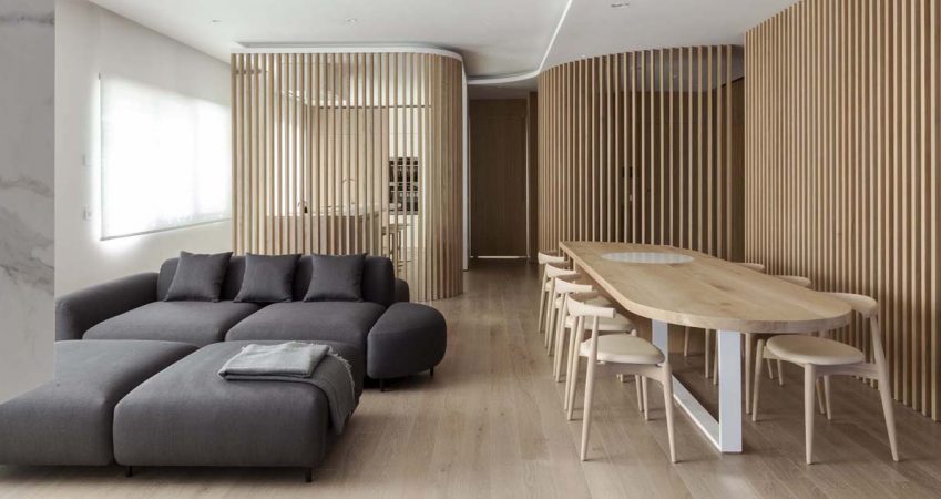 oak-slat-walls-divide-the-spaces-inside-this-apartment’s-interior