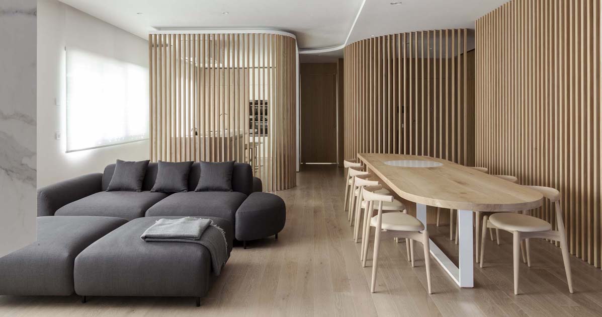 oak-slat-walls-divide-the-spaces-inside-this-apartment’s-interior