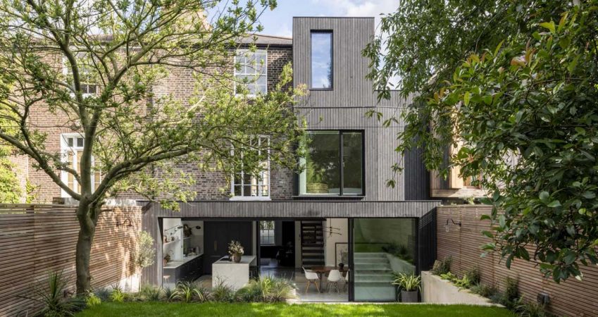 large-sliding-glass-doors-open-this-kitchen-and-dining-room-to-the-backyard