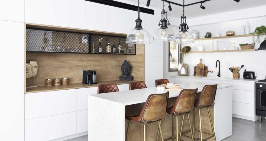 this-kitchen-island-was-designed-to-also-be-a-casual-dining-table-with-seating-on-both-sides