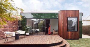 the-glazed-tiles-on-the-exterior-of-this-new-house-addition-are-a-remarkable-design-choice