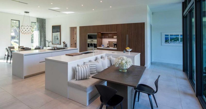 an-l-shaped-kitchen-island-is-a-creative-way-to-include-seating-and-a-table