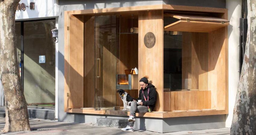 this-cafe-was-designed-like-a-wood-box-that-opens-to-allow-the-coffee-shop-to-interact-with-the-street
