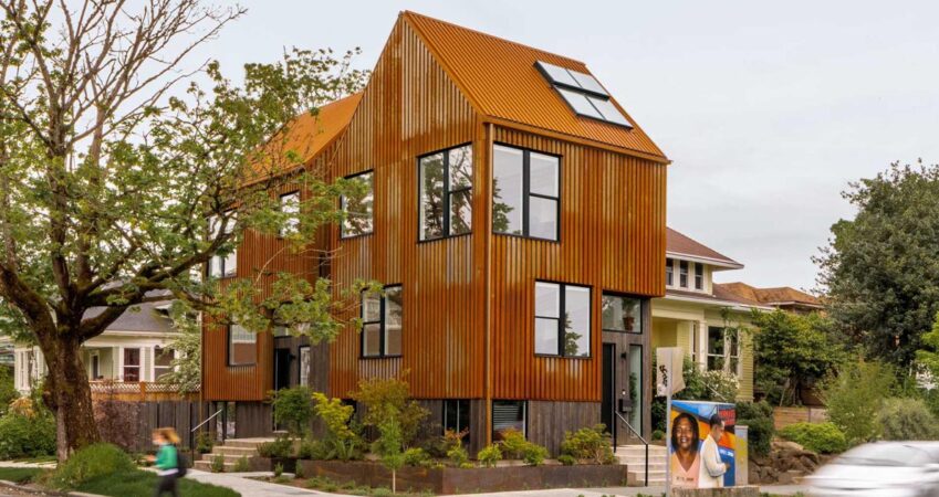 a-rusted-metal-exterior-allows-this-townhouse-to-stand-out-on-the-corner