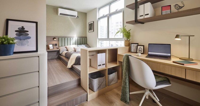 a-raised-bed-creates-a-separate-space-from-the-home-office-in-this-apartment-bedroom