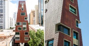 perforated-metal-panels-cover-the-exterior-of-this-apartment-building-in-brazil