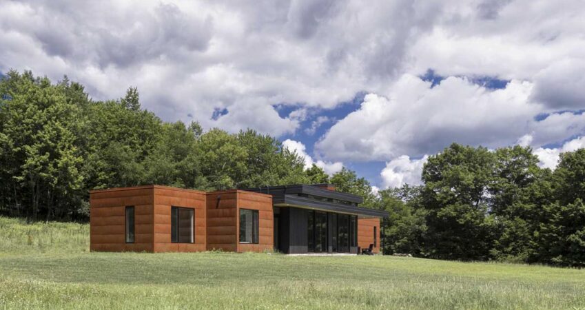 rusty-weathered-steel-siding-covers-this-small-home-in-rural-new-york