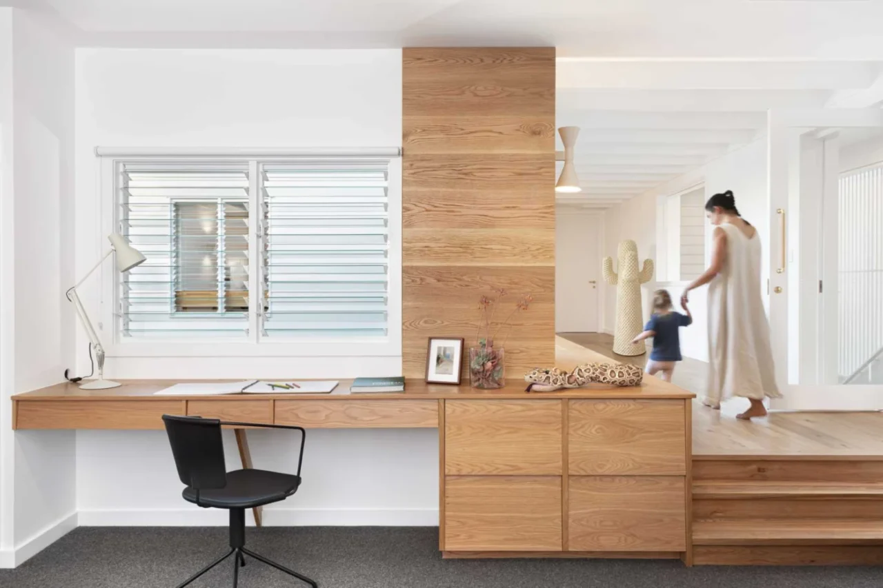 Built-in wood desk with storage in the rumpus room