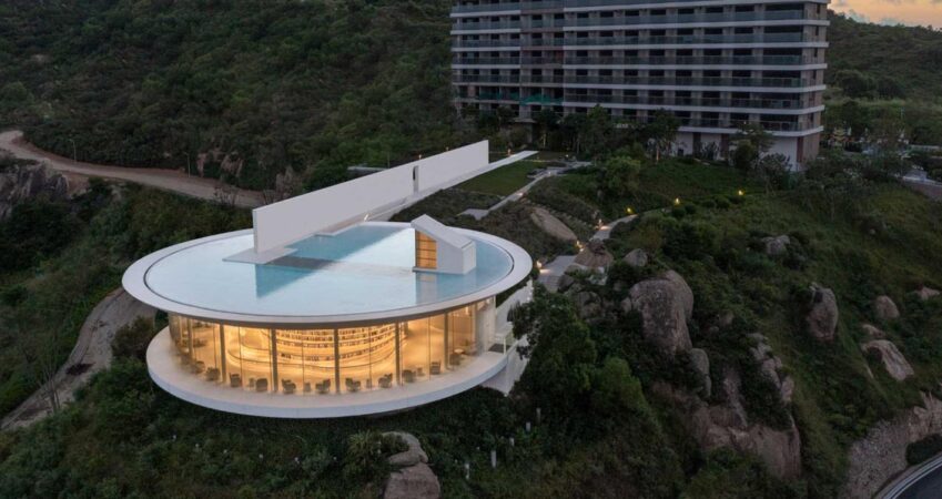 a-shallow-pool-sits-on-top-of-this-modern-library