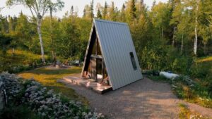 a-net-loft-is-made-possible-from-the-high-ceiling-inside-this-a-frame-cabin