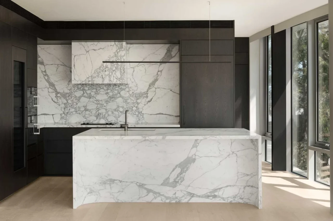 Kitchen with natural timber joinery and book-matched marble