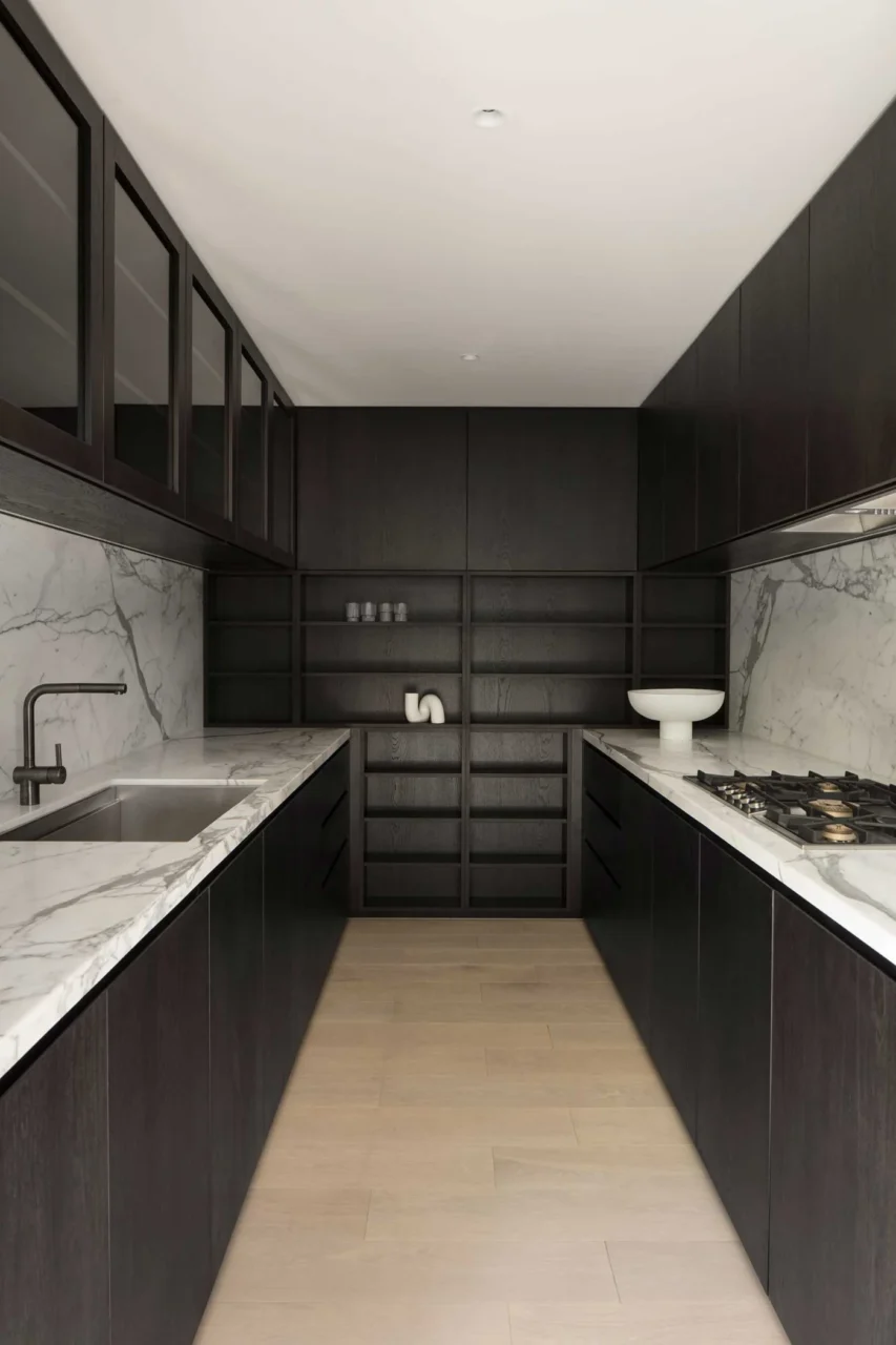 Timber and marble kitchen in one of the 16 apartments