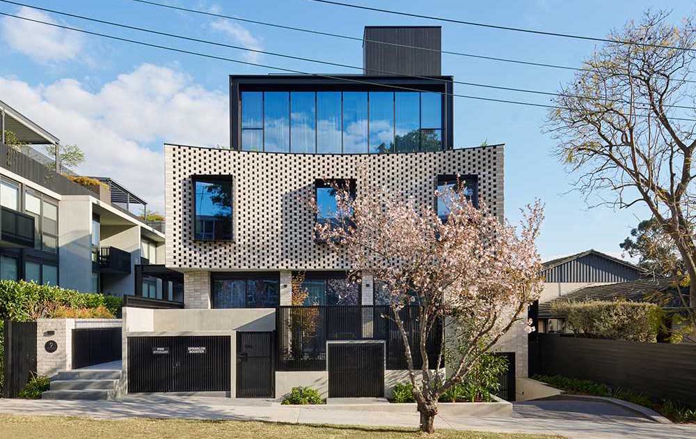 a-curved-brick-facade-presents-a-contemporary-face-for-this-collection-of-townhomes