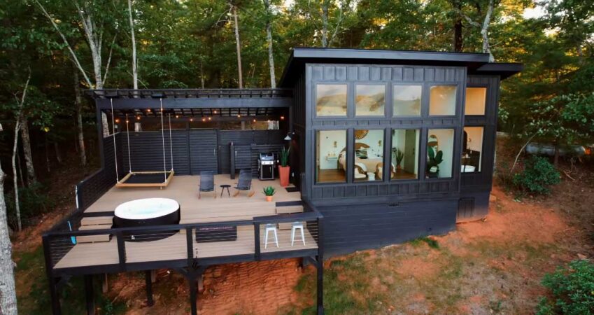 black-board-and-batten-siding-covers-the-exterior-of-this-cabin-in-the-mountains