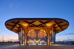 elegant-cathedral-like-wood-columns-support-a-canopy-over-this-new-supermarket