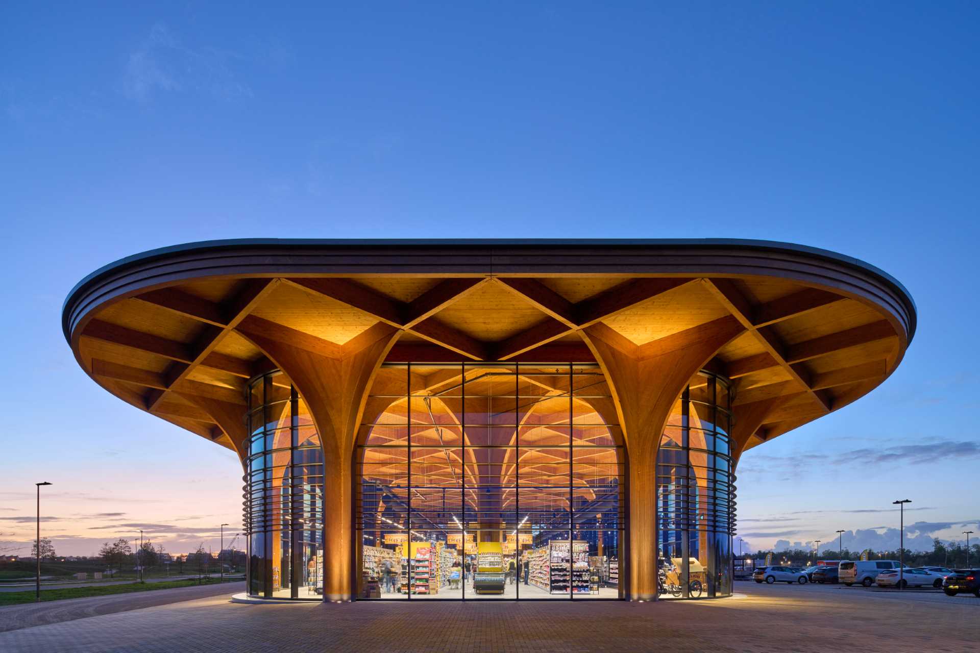 elegant-cathedral-like-wood-columns-support-a-canopy-over-this-new-supermarket