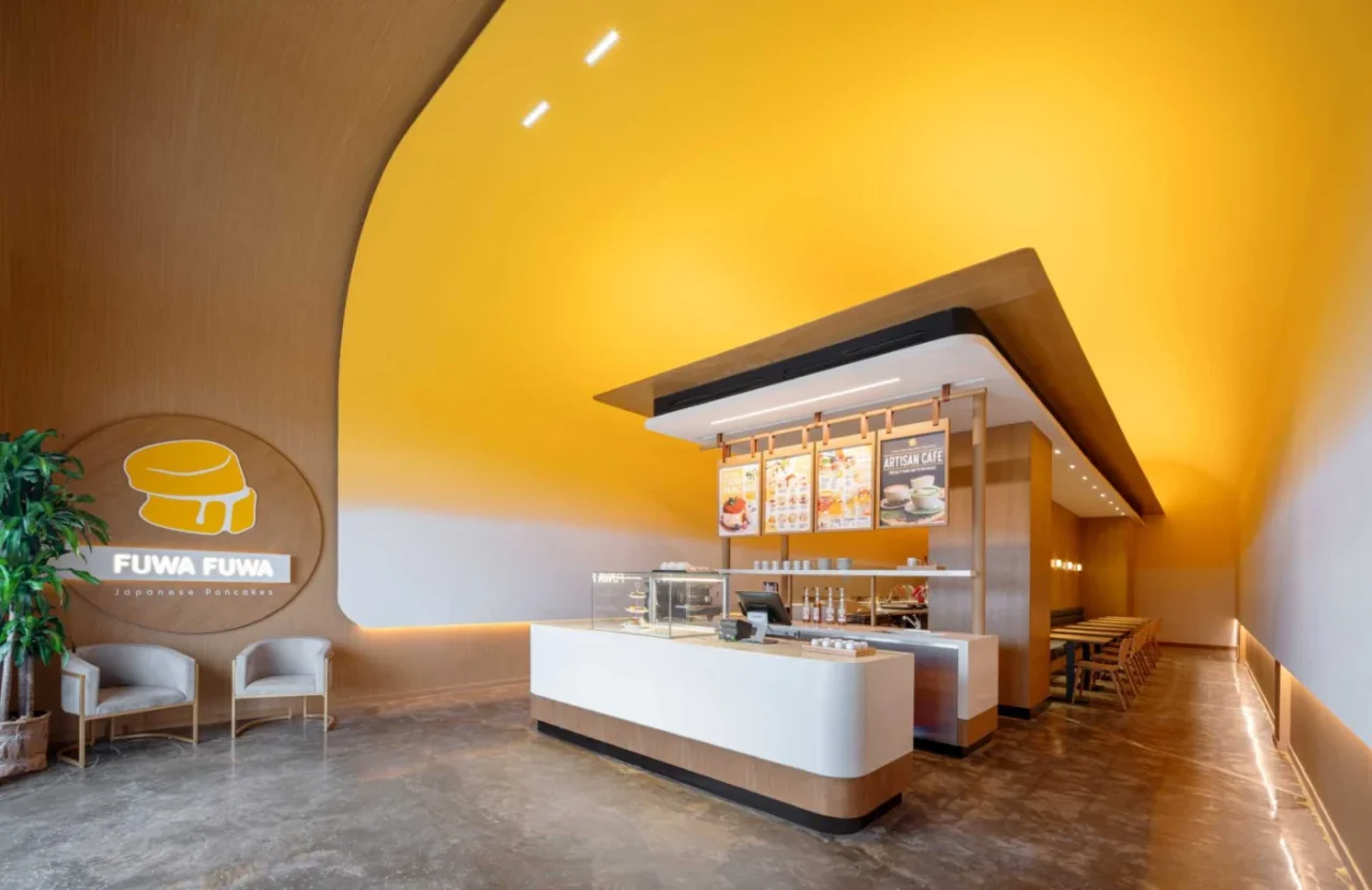 Curved yellow ceiling framing the temple-like service area