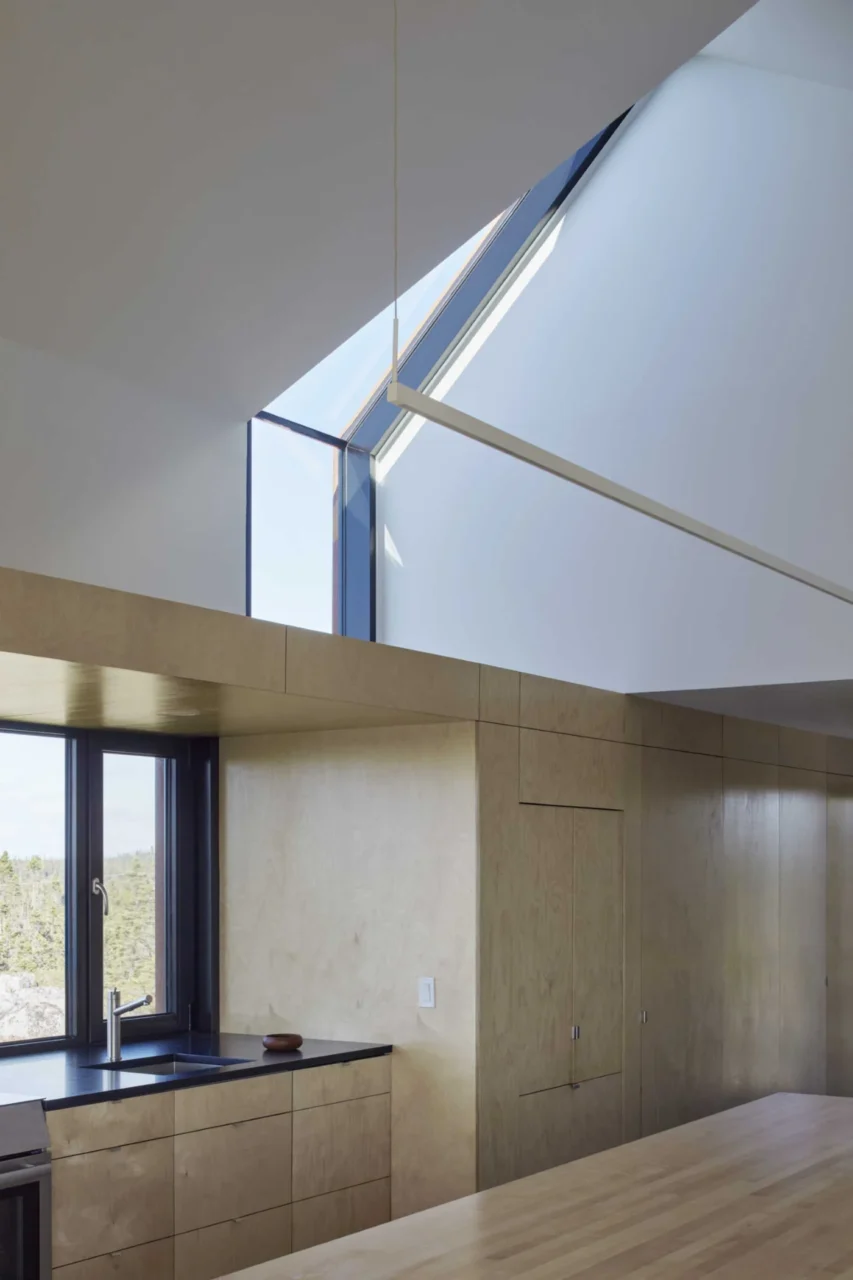 Black-framed window turning into a skylight inside the house