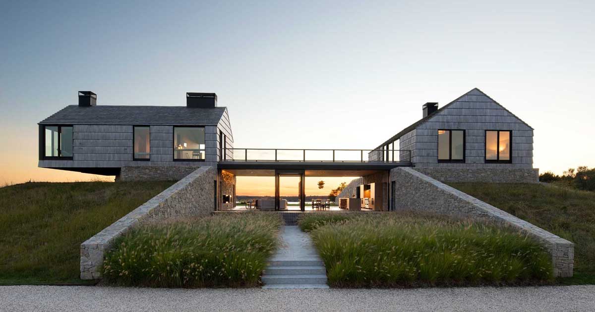 two-shingle-covered-cottages-connected-by-a-living-room-and-kitchen-in-between