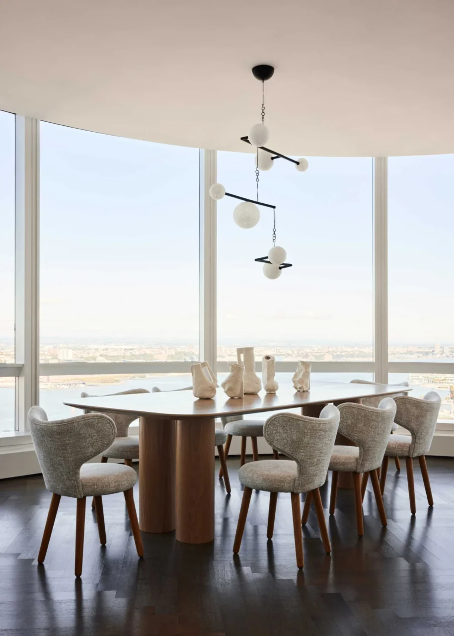 Dining area with an oak table designed by Jessica Gersten