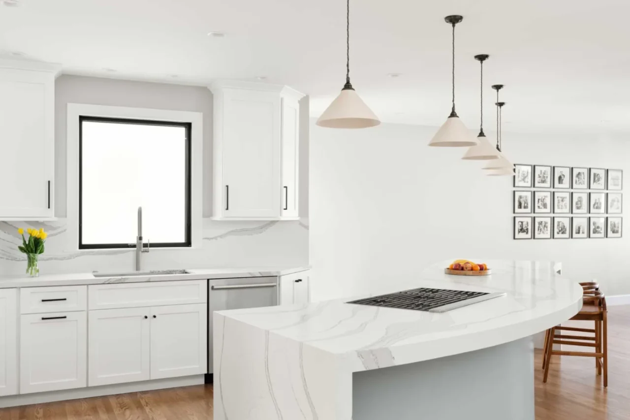Remodelled San Francisco home with a white kitchen and a curving S-shaped island