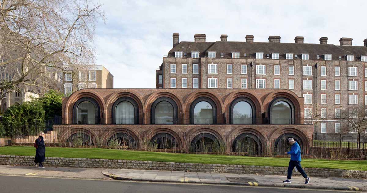 pivoting-arched-windows-are-a-unique-feature-on-this-row-of-townhouses-in-london