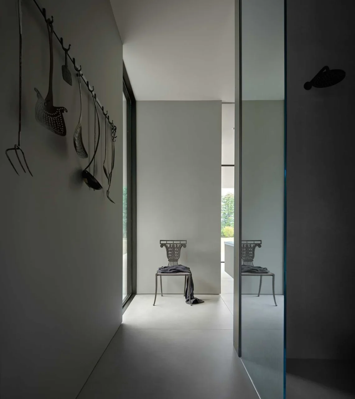 Primary bathroom used as a setting for the owners' art and furniture