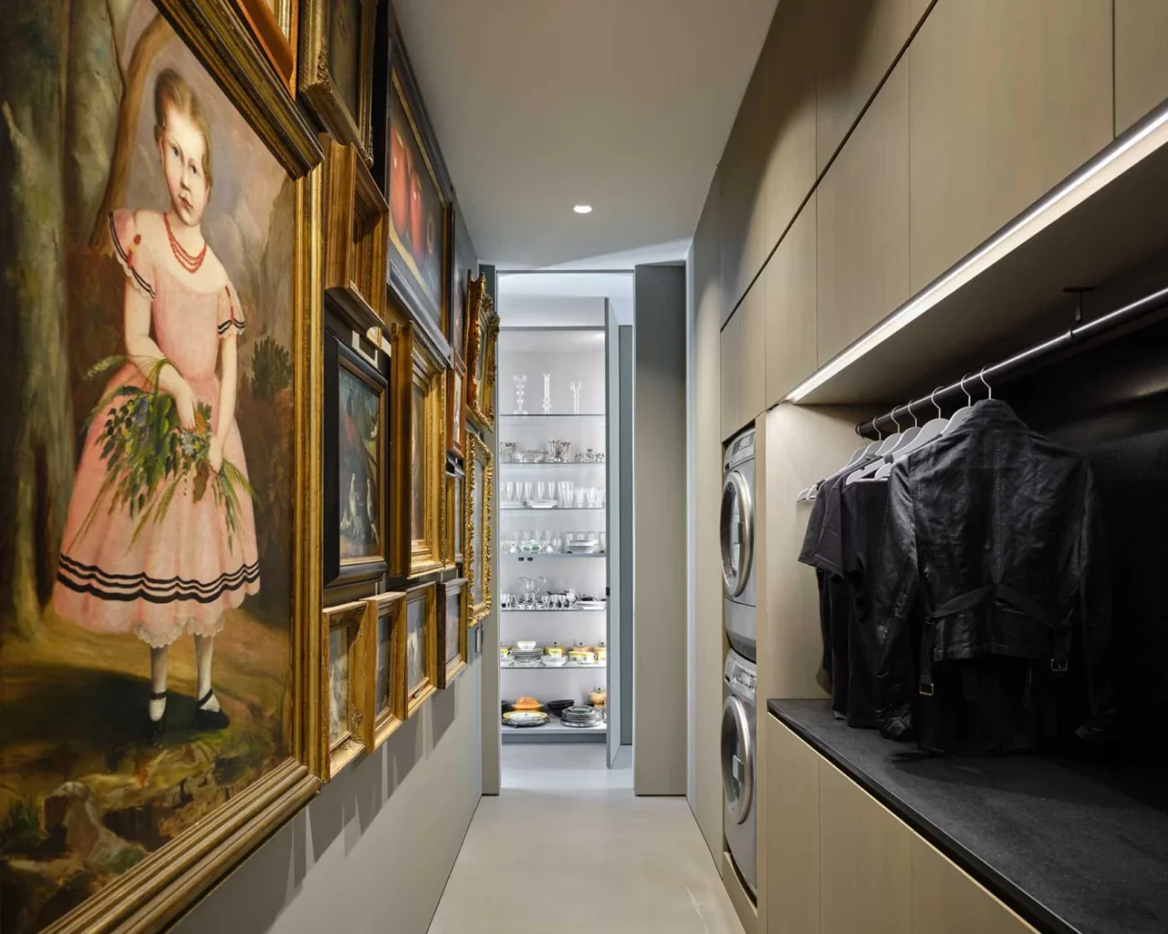 Laundry room with a whole wall of artwork