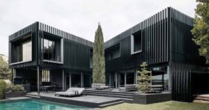 vertical-fins-surround-the-exterior-of-this-house-giving-it-a-distinct-appearance