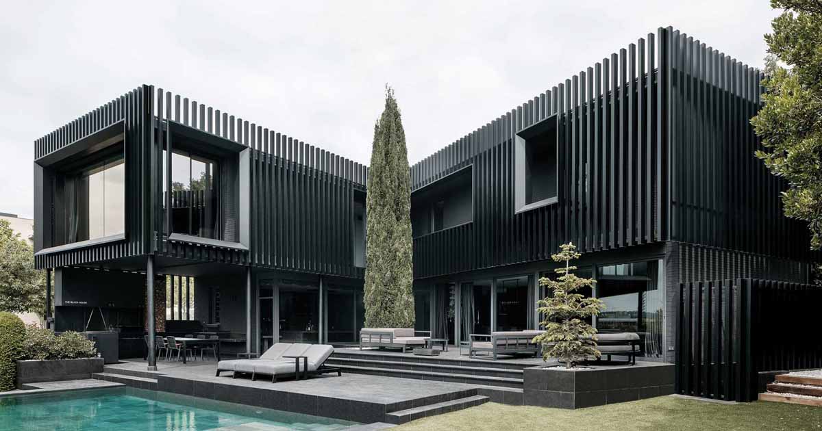 vertical-fins-surround-the-exterior-of-this-house-giving-it-a-distinct-appearance