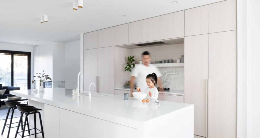 white-stained-oak-cabinets-paired-with-cool-white-marble-creates-a-soft-aesthetic-inside-this-home