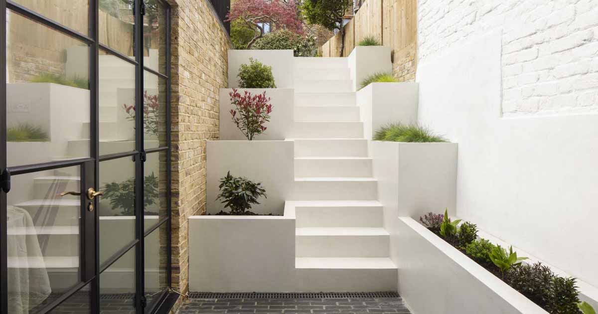 stairs-with-built-in-planters-lead-to-the-back-garden-at-this-home