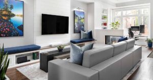 a-fireplace-divides-this-long-living-room-creating-a-separate-home-office-area