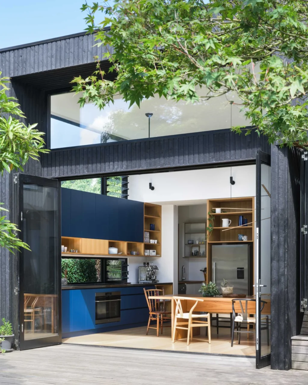 Bi-fold doors opening the kitchen and dining area to the yard
