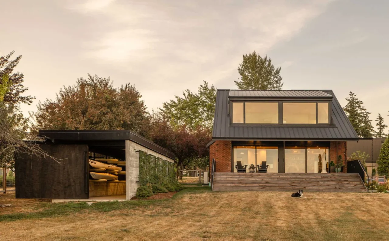 Half-buried concrete boathouse with a green roof near the farmhouse