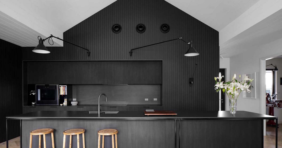 a-black-kitchen-is-a-bold-design-choice-for-this-home