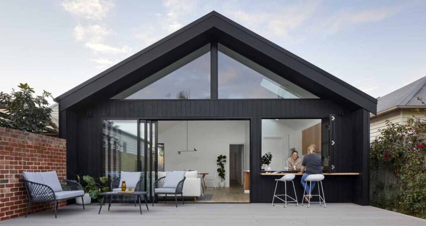 the-new-addition-on-this-home-includes-a-pass-through-window-to-the-kitchen