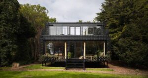 plants-are-encouraged-to-grow-over-the-exterior-of-this-new-house
