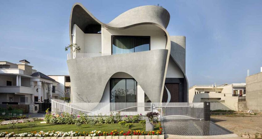 the-sculptural-exterior-of-this-house-was-inspired-by-the-folds-of-a-ribbon