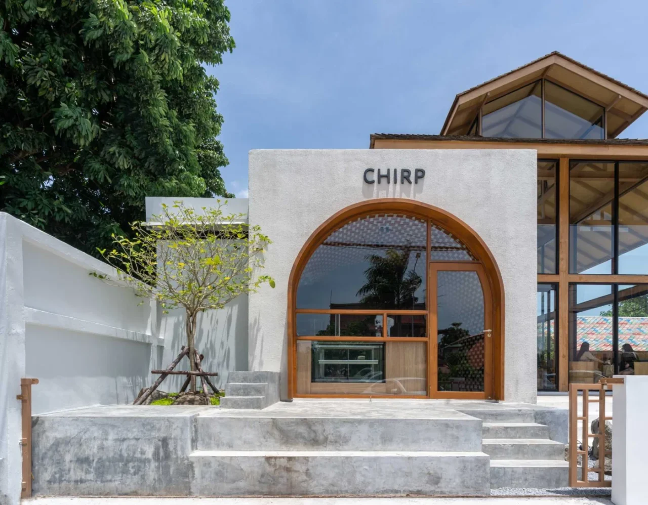 CHIRP cafe in Ayutthaya, Thailand, a cube-shaped building with an arched window facade